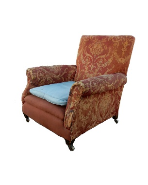 An Edwardian upholstered armchair