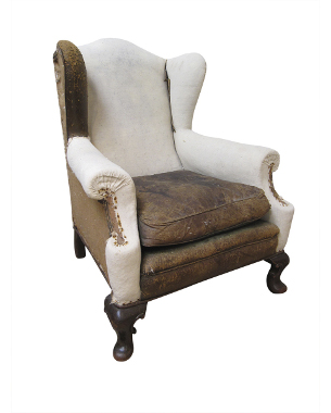 A George II mahogany leather wing armchair