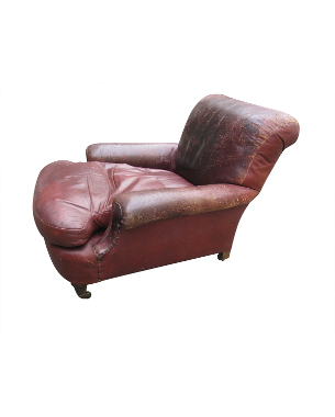 An  Edwardian mahogany and red leather deep club armchair