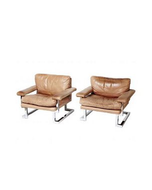 Pair of Mandarin chrome and leather armchairs by Pieff