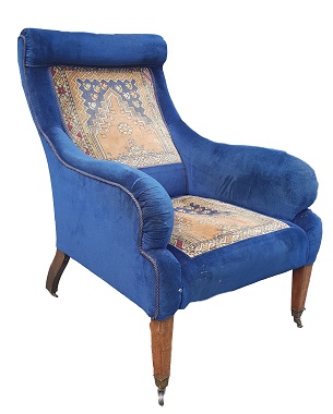 A late Victorian upholstered armchair