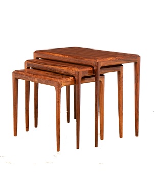 A nest of 3 rosewood tables
