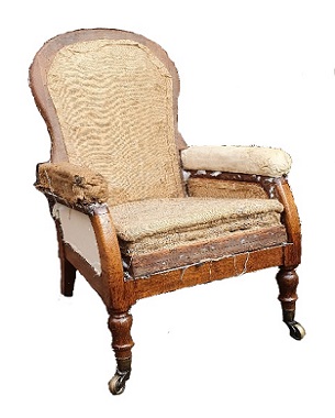 A Victorian oak reclining library armchair