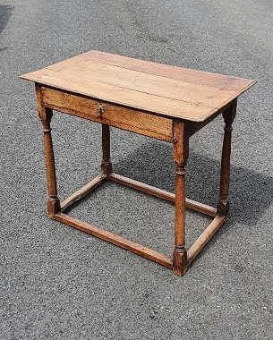 A late 17th Century elm side table