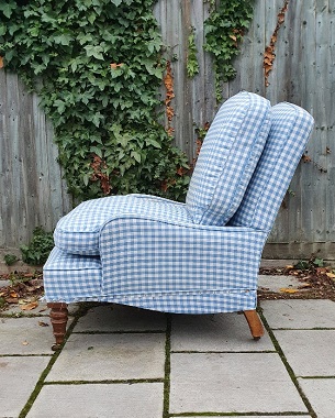 A  deep upholstered armchair