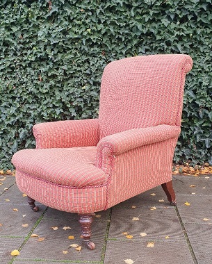 A  late Victorian mahogany upholstered armchair