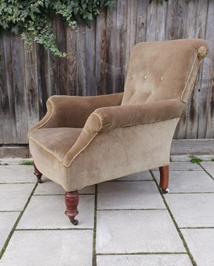 An  Edwardian upholstered armchair
