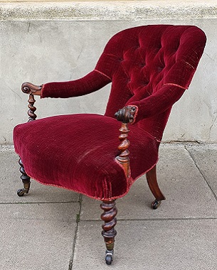 An  early Victorian rosewood open armchair