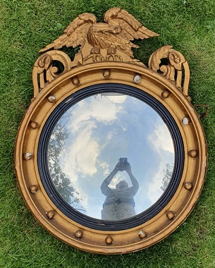 A  large giltwood convex mirror