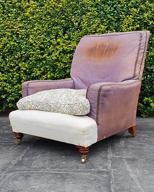 A    large Edwardian mahogany upholstered armchair