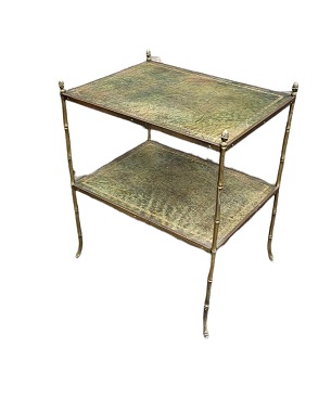 A brass and leather two-tier table
