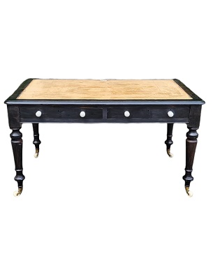 A   mid Victorian 'ebonised' library table