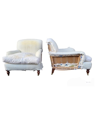 A    pair of 'Howard style upholstered armchairs