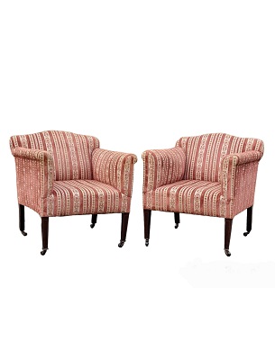 A     pair of Edwardian upholstered armchairs