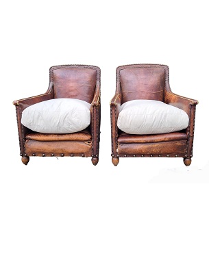 A    French pair of leather easy armchairs