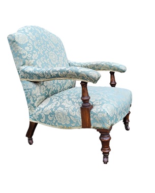 A    late Victorian walnut open upholstered armchair