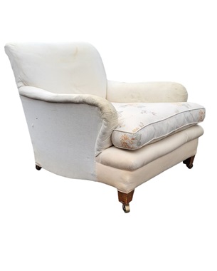 A       Edwardian Howard-style upholstered armchair