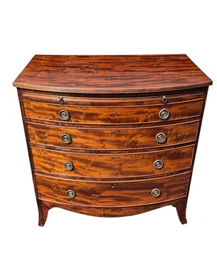 A       bow-front flamed mahogany chest of drawers