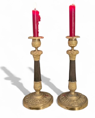 a            pair of French Empire gilt bronze candlesticks