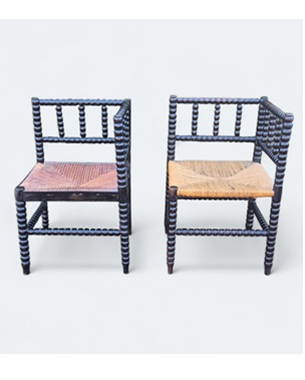 a                near pair of Liberty 'Norfolk' bobbin corner chairs