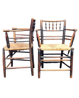 a            pair of Sussex armchairs