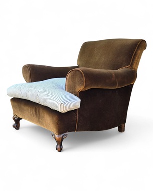 A                Howard-style upholstered armchair