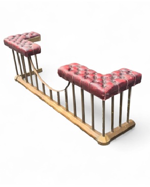 a               brass and leather club fender