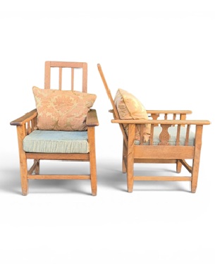 a                 pair of Arts & Crafts pale oak reclining armchairs