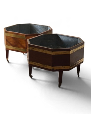 a                                pair of Georgian-style mahogany & brass octagonal cellarettes