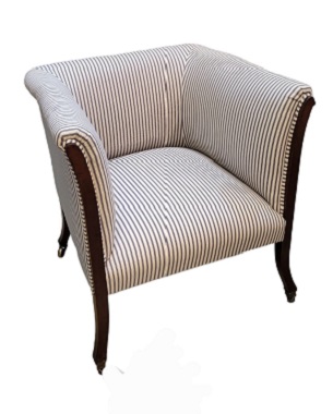 a   late Victorian mahogany upholstered armchair